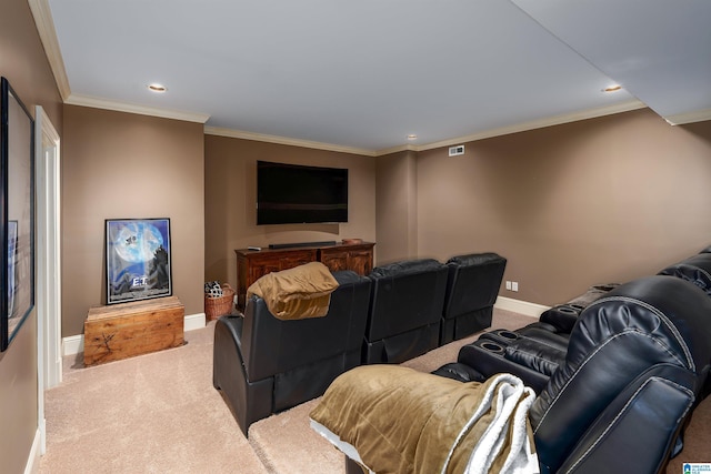 carpeted home theater featuring ornamental molding