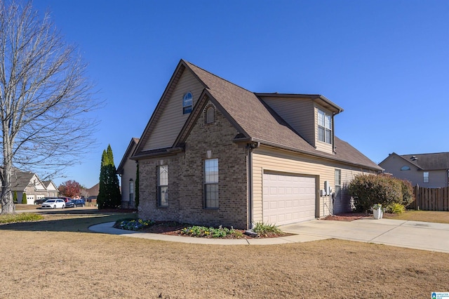 view of side of property with a garage