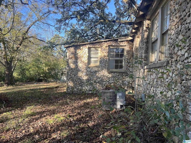 view of home's exterior with cooling unit