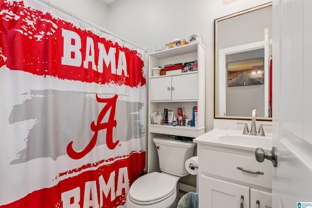 bathroom featuring vanity and toilet