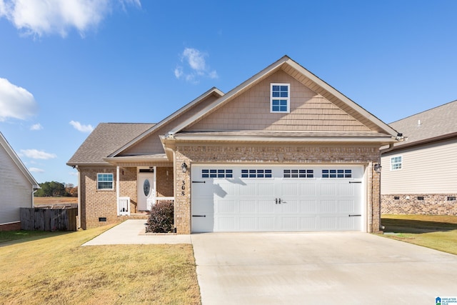 craftsman house featuring a garage and a front yard