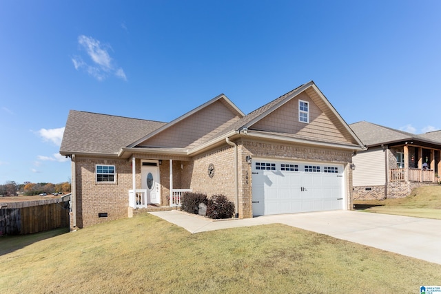 craftsman house with a front yard and a garage