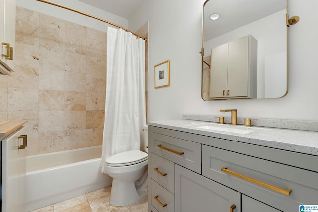 full bathroom featuring tile patterned floors, vanity, toilet, and shower / bath combo with shower curtain