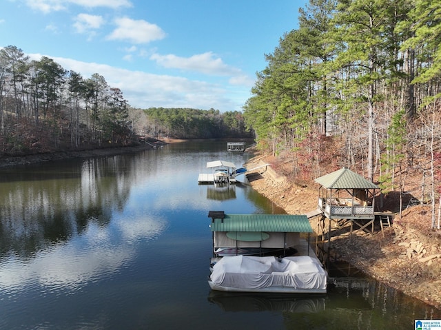 dock area with a gazebo and a water view