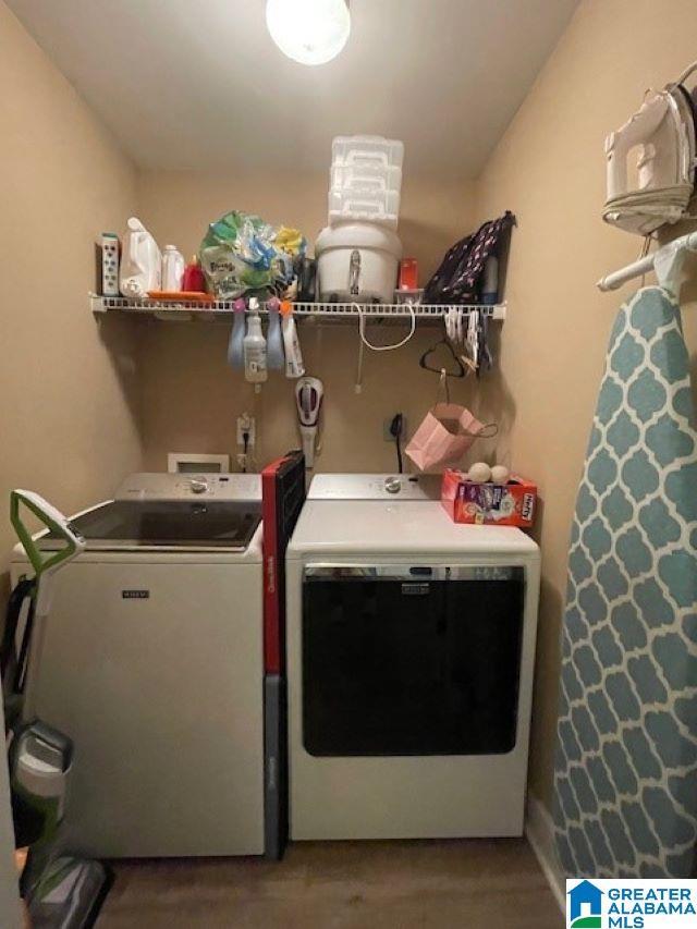 clothes washing area featuring independent washer and dryer