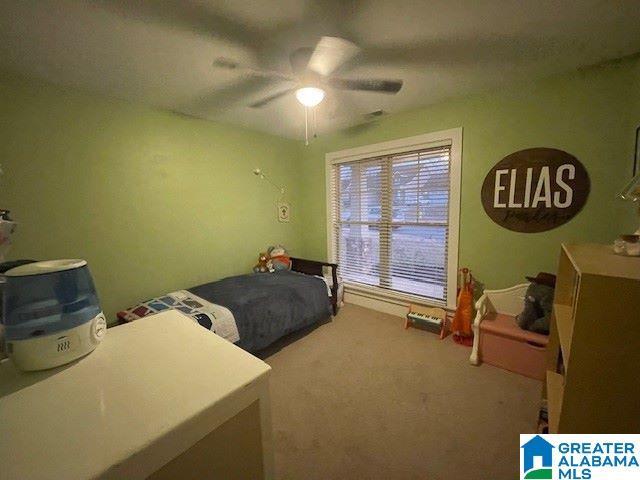 bedroom with carpet and ceiling fan