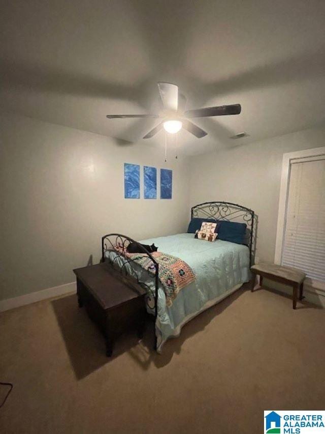 carpeted bedroom with ceiling fan