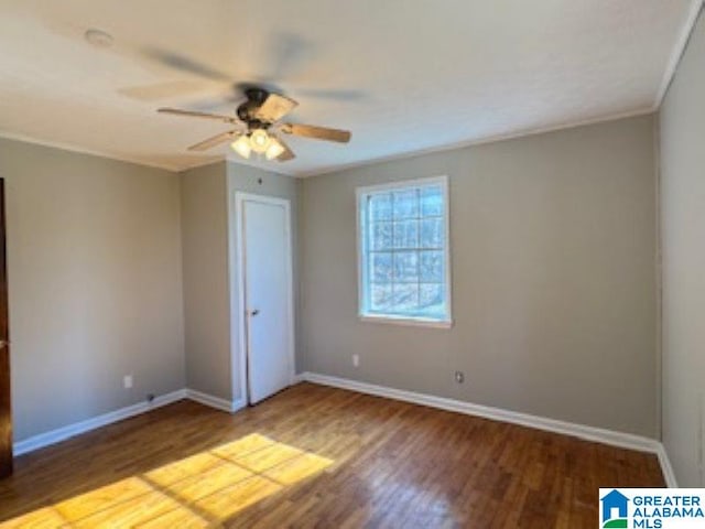 unfurnished bedroom with hardwood / wood-style flooring, ceiling fan, and crown molding