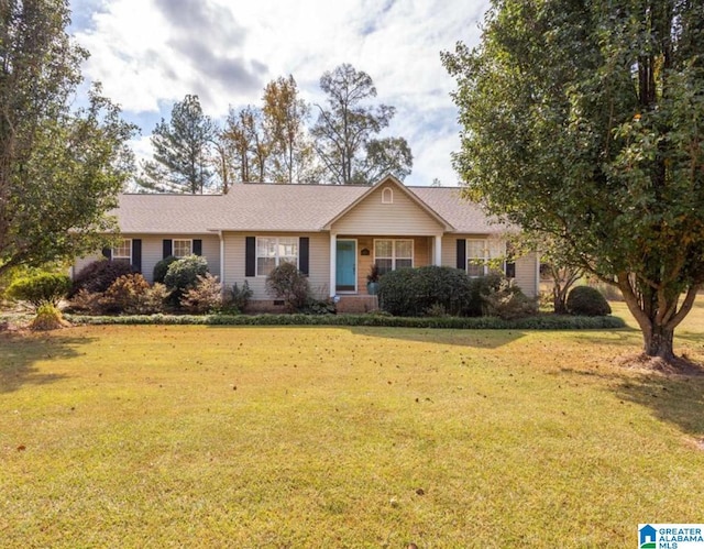 ranch-style home with a front yard