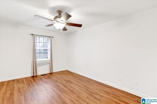 unfurnished room featuring light hardwood / wood-style flooring and ceiling fan