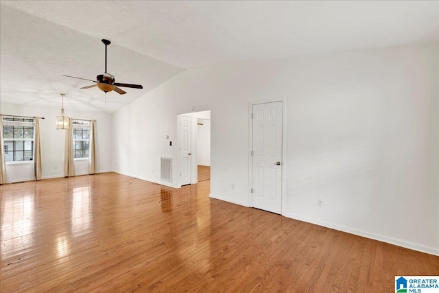 unfurnished room featuring light hardwood / wood-style flooring, vaulted ceiling, and ceiling fan