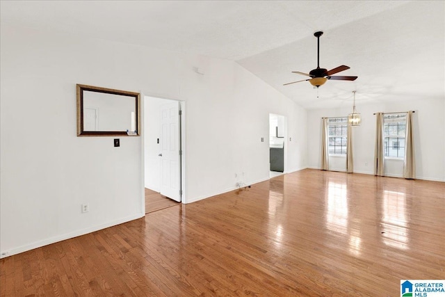 unfurnished living room with light wood-type flooring, high vaulted ceiling, and ceiling fan