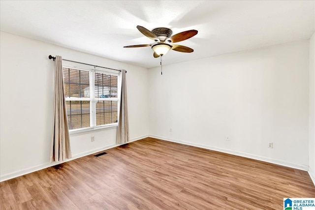 unfurnished room featuring ceiling fan and light wood-type flooring