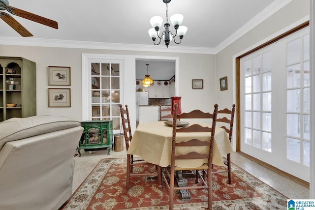 dining area with ceiling fan with notable chandelier, a wood stove, and crown molding