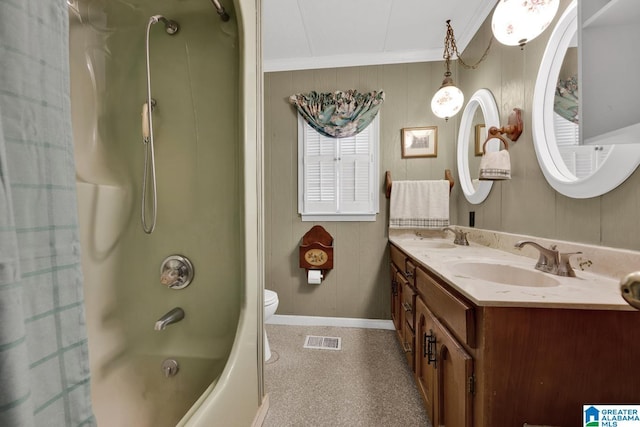 full bathroom featuring shower / bath combo, toilet, crown molding, and vanity