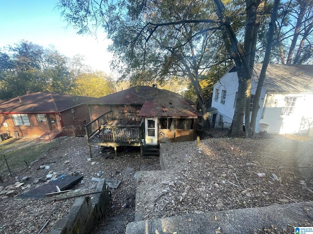 rear view of house with a deck