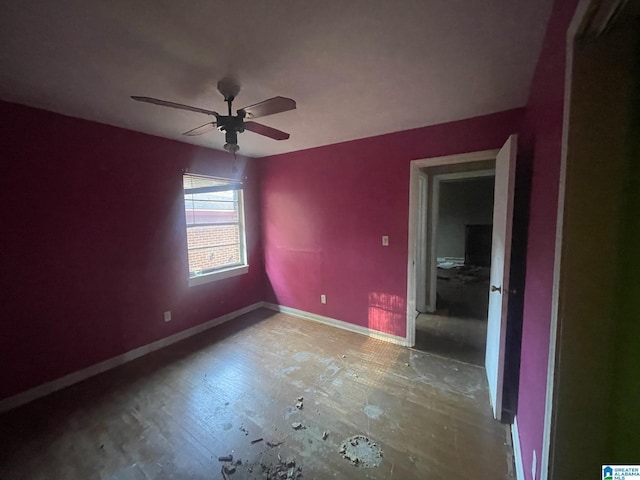 unfurnished room with hardwood / wood-style flooring and ceiling fan