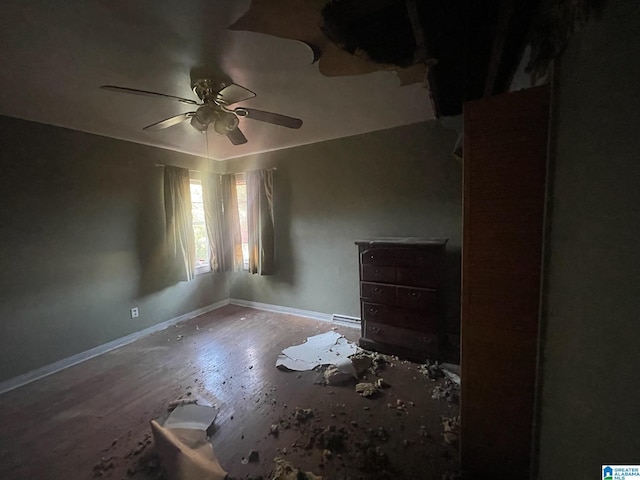 unfurnished bedroom featuring hardwood / wood-style flooring and ceiling fan