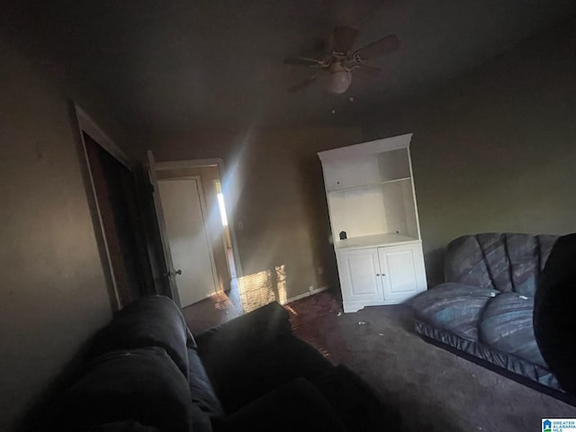 interior space with ceiling fan