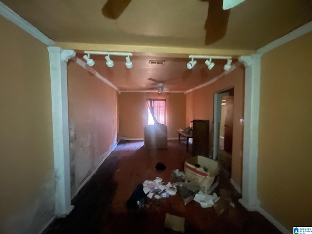 miscellaneous room featuring crown molding and track lighting