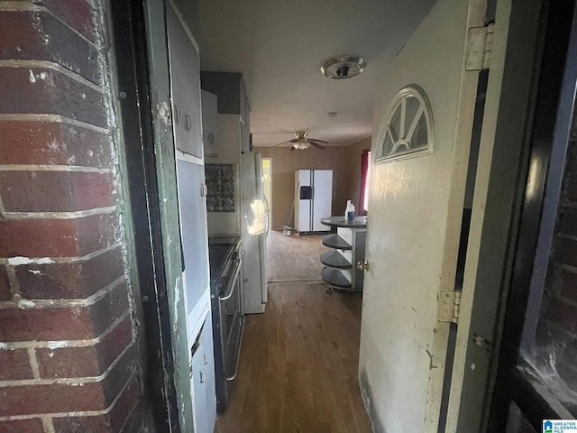 corridor with wood-type flooring