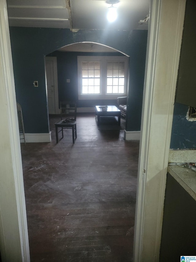 corridor with dark wood-type flooring