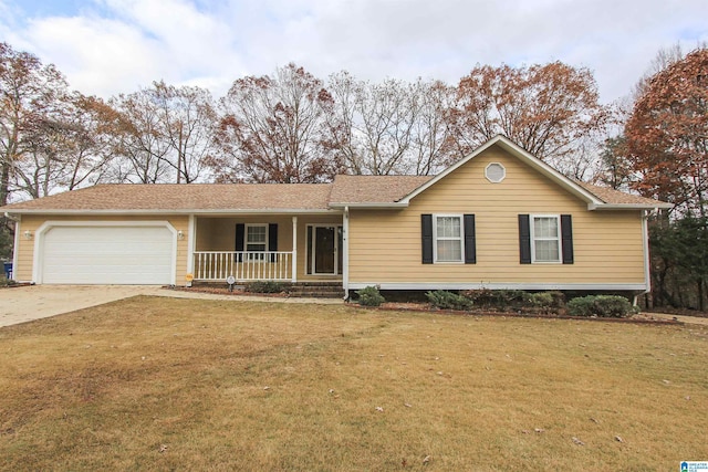 ranch-style home featuring covered porch, a garage, and a front lawn