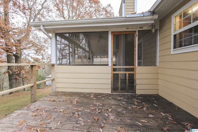 view of exterior entry featuring a deck