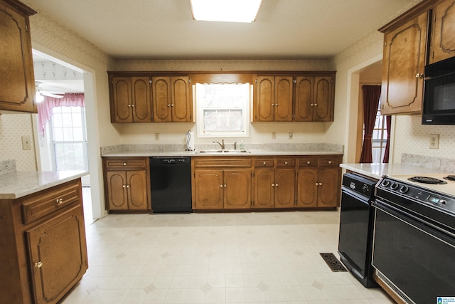 kitchen with sink and black appliances