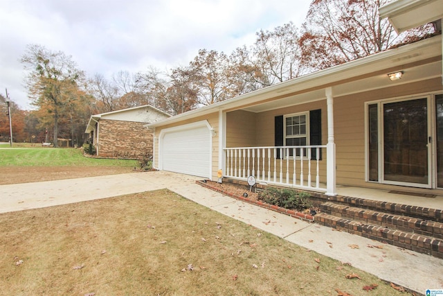 view of side of home with a porch and a garage