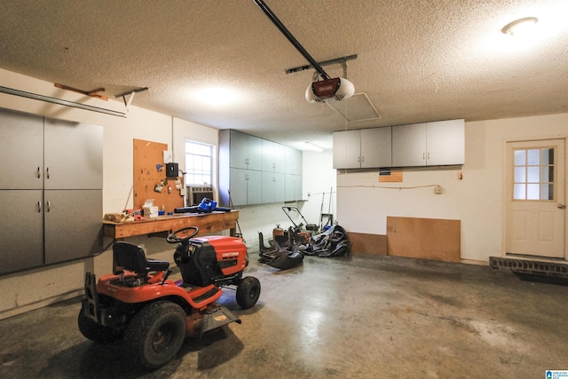 garage featuring a workshop area and a garage door opener