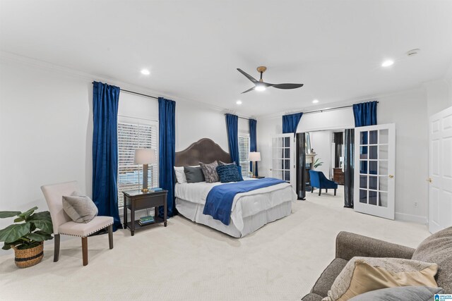 bedroom with ceiling fan, light colored carpet, and ornamental molding