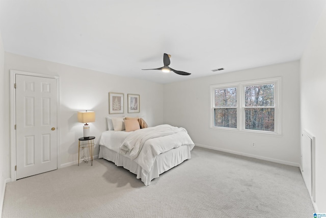 bedroom with ceiling fan and light colored carpet