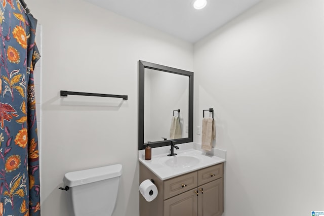 bathroom with vanity and toilet