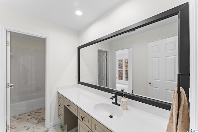 bathroom featuring vanity and tiled shower / bath combo