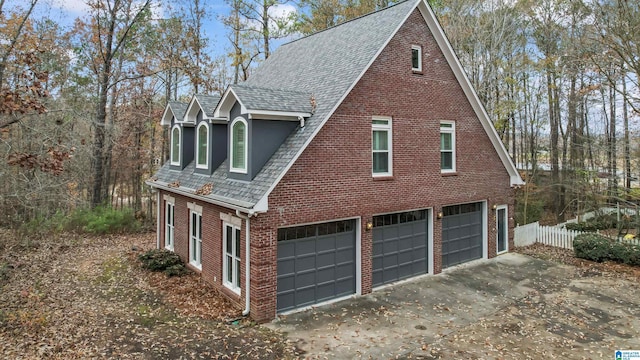 view of side of home featuring a garage