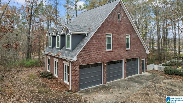 view of property exterior with a garage