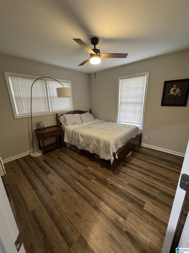 bedroom with ceiling fan and dark wood-type flooring