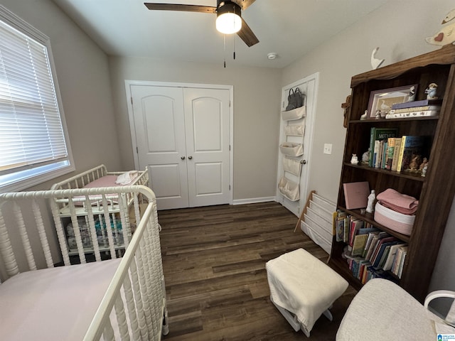 bedroom featuring a closet, ceiling fan, and dark hardwood / wood-style flooring