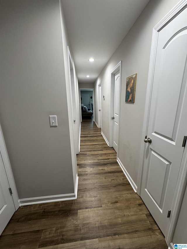 hall with dark hardwood / wood-style floors