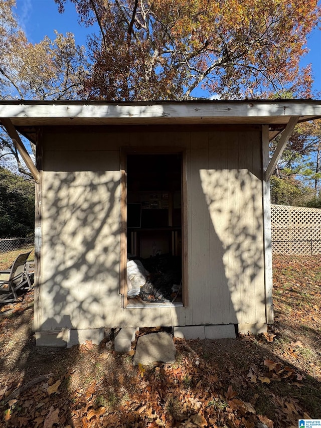 exterior space with a shed