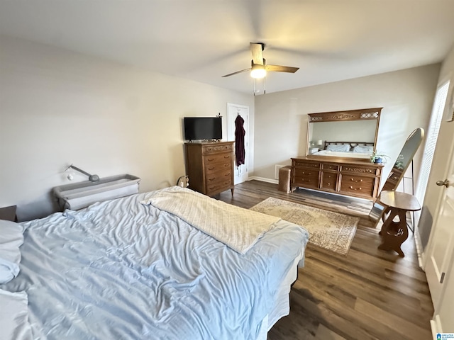 bedroom featuring ceiling fan and dark hardwood / wood-style flooring