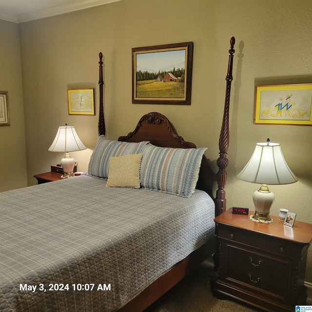 carpeted bedroom featuring ornamental molding