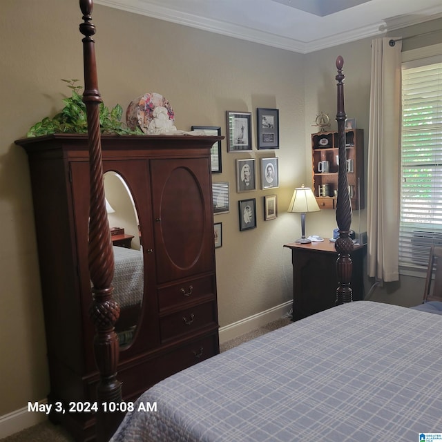 bedroom with baseboards and crown molding