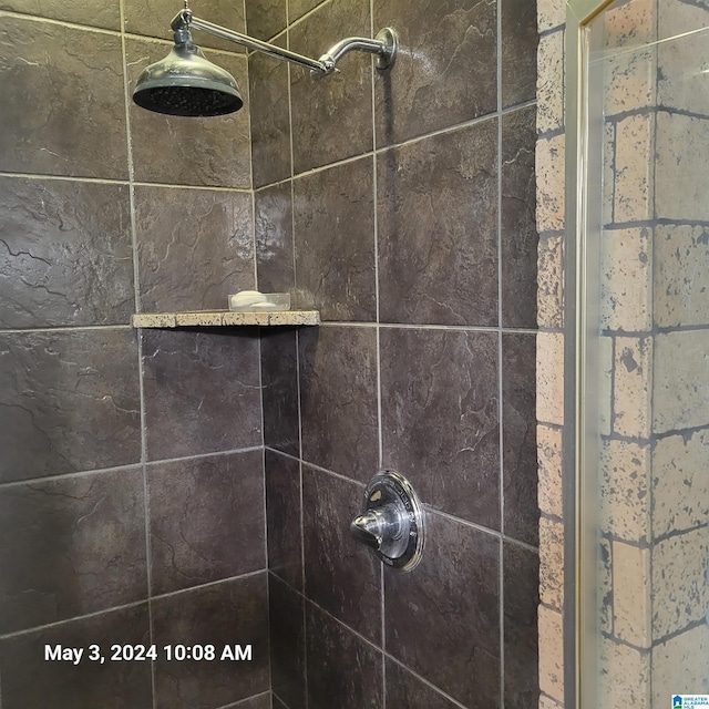 details featuring a tile shower