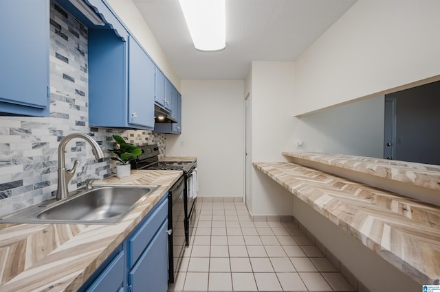 kitchen featuring backsplash, light tile patterned flooring, sink, and blue cabinetry