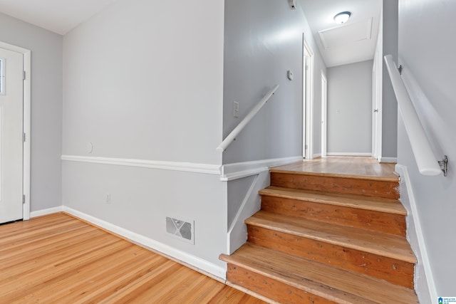 staircase featuring hardwood / wood-style floors