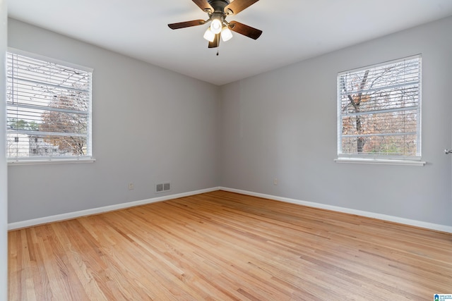 unfurnished room featuring ceiling fan and light hardwood / wood-style flooring