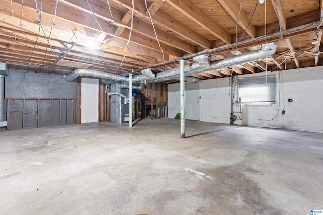 basement featuring heating unit