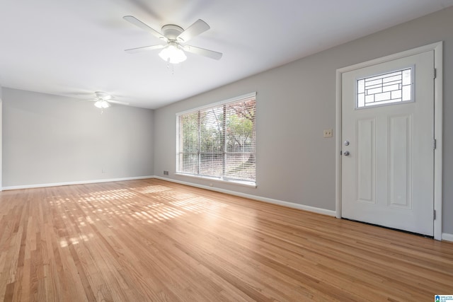 entrance foyer featuring ceiling fan and light wood-type flooring